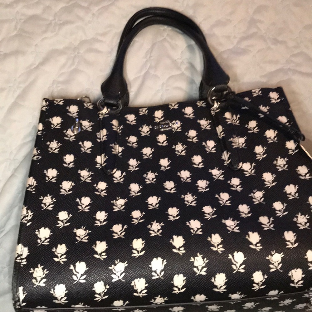 Coach leather purse with white rose pattern